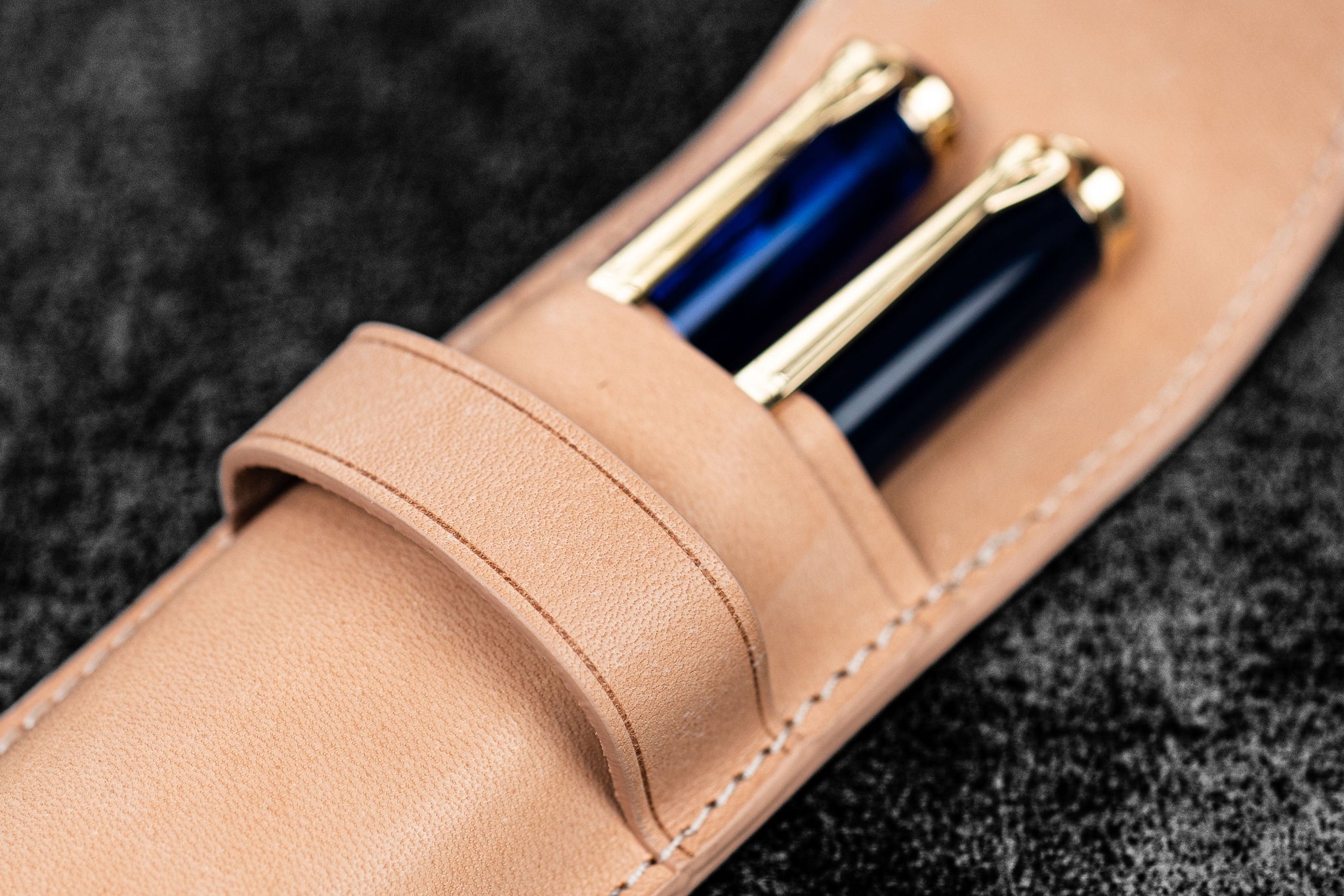 Leather pen case with flap closure over for 2 pens