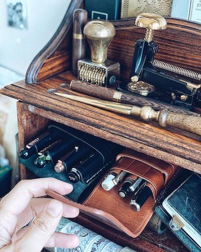 leather pen case on desk